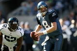 SEATTLE - OCTOBER 11:  Quarterback Matt Hasselbeck #8 of the Seattle Seahawks scrambles against linebacker Daryl Smith #52 of the Jacksonville Jaguars on October 11, 2009 at Qwest Field in Seattle, Washington. The Seahawks defeated the Jaguars 41-0. (Photo by Otto Greule Jr/Getty Images)
