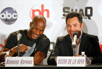 LAS VEGAS - AUGUST 18:  Bernard Hopkins (L) and Oscar De La Hoya talk as they tape a segment with Shaquille O' Neal of the Cleveland Cavaliers for the new ABC television series 'Shaq Vs.' at the Planet Hollywood Resort & Casino August 18, 2009 in Las Vegas, Nevada. The reality show, which launches tonight, follows O'Neal as he competes against star athletes in their respective sports.  (Photo by Ethan Miller/Getty Images)