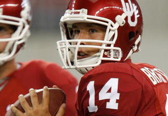 ARLINGTON, TX - SEPTEMBER 05:  Quarterback Sam Bradford #14 of the Oklahoma Sooners warms up before a game against the Brigham Young Cougars at Cowboys Stadium on September 5, 2009 in Arlington, Texas.  (Photo by Ronald Martinez/Getty Images)