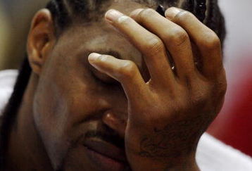 ATLANTA - APRIL 29:  Udonis Haslem #40 of the Miami Heat reacts while sitting on the bench late in the game against the Atlanta Hawks during Game Five of the Eastern Conference Quarterfinals at Philips Arena on April 29, 2009 in Atlanta, Georgia. The Hawks defeated the Heat 106-91. NOTE TO USER: User expressly acknowledges and agrees that, by downloading and/or using this Photograph, user is consenting to the terms and conditions of the Getty Images License Agreement.  (Photo by Doug Benc/Getty Images)
