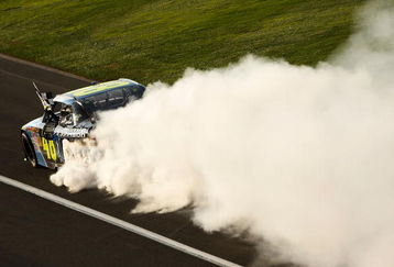 FONTANA, CA - OCTOBER 11:  Jimmie Johnson, driver of the #48 Lowe's Chevrolet, performs a burnout to celebrate winning the NASCAR Sprint Cup Series Pepsi 500 at Auto Club Speedway on October 11, 2009 in Fontana, California.  (Photo by Chris Graythen/Getty Images)