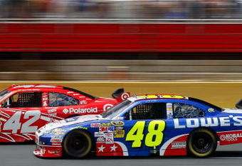 CONCORD, NC - MAY 25:  Juan Pablo Montoya, driver of the #42 Target Chevrolet, races Jimmie Johnson, driver of the #48 Lowe's Chevrolet, during the NASCAR Sprint Cup Series Coca-Cola 600 on May 25, 2009 at Lowe's Motor Speedway in Concord, North Carolina.  (Photo by Jason Smith/Getty Images)
