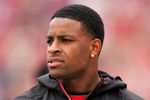 SAN FRANCISCO - OCTOBER 11:  Michael Crabtree, the San Francisco 49ers first round draft pick, watches the 49ers game against the Atlanta Falcons on the sidelines at Candlestick Park on October 11, 2009 in San Francisco, California.  (Photo by Ezra Shaw/Getty Images)