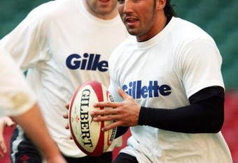 CARDIFF, WALES - MARCH 18:  Gavin Henson, the Wales centre holds onto the ball during the Welsh rubgy union training prior to tomorrows RBS Six Nations International between Wales and Ireland at The Millennium Stadium on March 18, 2005 in Cardiff, Wales. (Photo by David Rogers/Getty Images)