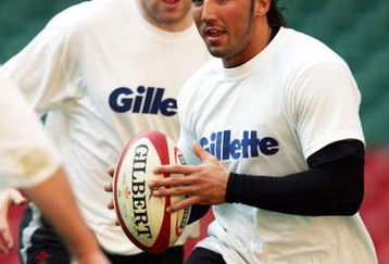 CARDIFF, WALES - MARCH 18:  Gavin Henson, the Wales centre holds onto the ball during the Welsh rubgy union training prior to tomorrows RBS Six Nations International between Wales and Ireland at The Millennium Stadium on March 18, 2005 in Cardiff, Wales. (Photo by David Rogers/Getty Images)