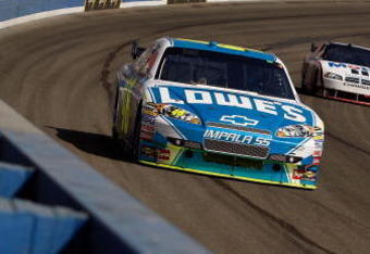 FONTANA, CA - OCTOBER 11:  Jimmie Johnson, driver of the #48 Lowe's Chevrolet, leads Sam Hornish Jr., driver of the #77 Mobil 1 Dodge, during the NASCAR Sprint Cup Series Pepsi 500 at Auto Club Speedway on October 11, 2009 in Fontana, California.  (Photo by Chris Graythen/Getty Images)