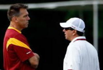 ASHBURN, VA - JULY 30:  Washington Redskins Head Coach Jim Zorn (C) talks with owner Daniel Snyder (R) as Executive Vice President for Football Operations Vinny Cerrato (L) looks on during the first day of training camp July 30, 2009 in Ashburn, Virginia.  (Photo by Win McNamee/Getty Images)