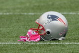 FOXBORO, MA - OCTOBER 4:  Randy Moss #81 of the New England Patriots  leaves  his pink gloves, worn to support Breast Cancer Awareness, on the field before a game with the Baltimore Ravens at Gillette Stadium on October 4, 2009 in Foxboro, Massachusetts. (Photo by Jim Rogash/Getty Images)