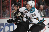 PHILADELPHIA - OCTOBER 22: Ryane Clowe #29 of the San Jose Sharks hits Steve Eminger #26 of the Philadelphia Flyers on October 22, 2008 at the Wachovia Center in Philadelphia, Pennsylvania. (Photo by Bruce Bennett/Getty Images)