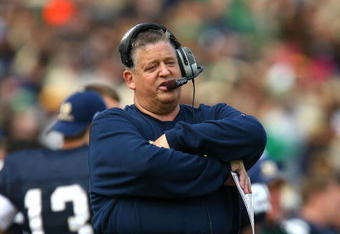 SOUTH BEND, IN - OCTOBER 03: Head coach Charlie Weis of the Notre Dame Fighting Irish watches as his team takes on the Washington Huskies on October 3, 2009 at Notre Dame Stadium in South Bend, Indiana.  Notre Dame defeated Washington 37-30 in overtime.  (Photo by Jonathan Daniel/Getty Images)