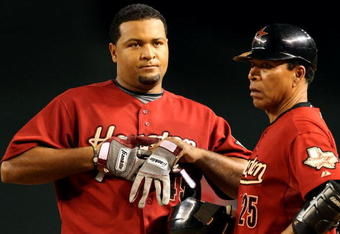 PHOENIX - AUGUST 29:  Carlos Lee #45 of the Houston Astros reacts with coach Jose Cruz after hitting a fly ball out against the Arizona Diamondbacks during the major league baseball game at Chase Field on August 29, 2009 in Phoenix, Arizona. The Diamondbacks defeated the Astros 9-0. (Photo by Christian Petersen/Getty Images)