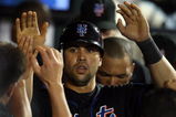 NEW YORK - JUNE 19:  Carlos Beltran #15 of the New York Mets celebrates in the dugout after scoring in the eigth inning against the Tampa Bay Rays on June 19, 2009 at Citi Field in the Flushing neighborhood of the Queens borough of New York City.  (Photo by Jim McIsaac/Getty Images)