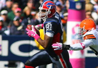 ORCHARD PARK, NY - OCTOBER 11: Terrell Owens #81 of the Buffalo Bills looks to run away from Mike Adams #20 of the Cleveland Browns at Ralph Wilson Stadium on October 11, 2009 in Orchard Park, New York. The Browns defeated the Bills 6-3. (Photo by Rick Stewart/Getty Images)