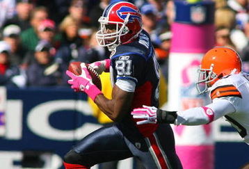 ORCHARD PARK, NY - OCTOBER 11: Terrell Owens #81 of the Buffalo Bills looks to run away from Mike Adams #20 of the Cleveland Browns at Ralph Wilson Stadium on October 11, 2009 in Orchard Park, New York. The Browns defeated the Bills 6-3. (Photo by Rick Stewart/Getty Images)