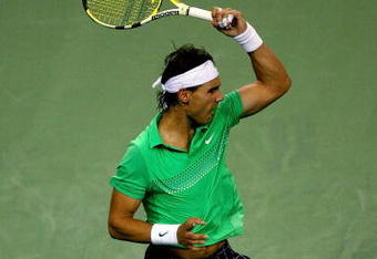 SHANGHAI, CHINA - OCTOBER 15:  Rafael Nadal of Spain returns a shot to Tommy Robredo of Spain during day five of the 2009 Shanghai ATP Masters 1000 at Qi Zhong Tennis Centre on October 15, 2009 in Shanghai, China.  (Photo by Matthew Stockman/Getty Images)