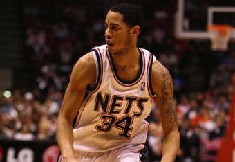 EAST RUTHERFORD, NJ - FEBRUARY 10:  Devin Harris #34 of the New Jersey Nets drives to the basket against the San Antonio Spurs during their game on February 10, 2009 at The Izod Center in East Rutherford, New Jersey.  NOTE TO USER: User expressly acknowledges and agrees that, by downloading and/or using this Photograph, user is consenting to the terms and conditions of the Getty Images License Agreement.  (Photo by Al Bello/Getty Images)