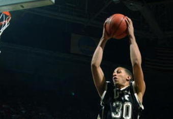 MILWAUKEE - MARCH 19:  Forward Josh Peppers #30 of the Central Florida Golden Knights grabs a rebound in front of forward Chevon Troutman #2 of the Pittsburgh Panthers during the first round game of the NCAA Division I Men's Basketball Tournament at Bradley Center on March 19, 2004 in Milwaukee, Wisconsin.  (Photo by Jonathan Daniel/Getty Images)