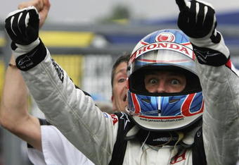 BUDAPEST, HUNGARY - AUGUST 06:  Jenson Button of Great Britain and Honda Racing celebrates his first ever Formula One victory after winning the Hungarian Formula One Grand Prix at the Hungaroring on August 6, 2006 in Budapest, Hunagary.  (Photo by Paul Gilham/Getty Images)