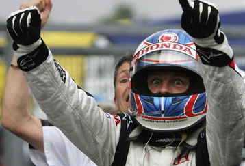 BUDAPEST, HUNGARY - AUGUST 06:  Jenson Button of Great Britain and Honda Racing celebrates his first ever Formula One victory after winning the Hungarian Formula One Grand Prix at the Hungaroring on August 6, 2006 in Budapest, Hunagary.  (Photo by Paul Gilham/Getty Images)