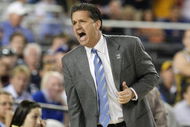GLENDALE, AZ - MARCH 26: Head Coach John Calipari of the Memphis Tigers adjusts his team against the Missouri Tigers in the Sweet 16 of the NCAA Division I Men's Basketball Tournament at the University of Phoenix Stadium on March 26, 2009 in Glendale, Arizona. (Photo by Ronald Martinez/Getty Images)