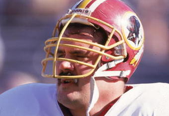 PHOENIX - DECEMBER 8:  Offensive linebacker Russ Grimm #68 of the Washington Redskins stands on the sideline during a game against the Phoenix Cardinals on December 8, 1991 at Sun Devil Stadium in Phoenix, Arizona. (Photo by Mike Powell/Getty Images)