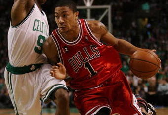 BOSTON - MAY 02:  Derrick Rose #1 of the Chicago Bulls drives to the net as Rajon Rondo #9 of the Boston Celtics defends in Game Seven of the Eastern Conference Quarterfinals during the 2009 NBA Playoffs at TD Banknorth Garden on May 2, 2009 in Boston, Massachusetts. The Celtics defeated the Bulls 109-99. NOTE TO USER: User expressly acknowledges and agrees that, by downloading and or using this photograph, User is consenting to the terms and conditions of the Getty Images License Agreement.  (Photo by Elsa/Getty Images)