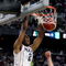 DETROIT - APRIL 04: Stanley Robinson #21 of the Connecticut Huskies dunks against Goran Suton #14 of the Michigan State Spartans during the National Semifinal game of the NCAA Division I Men's Basketball Championship at Ford Field on April 4, 2009 in Detroit, Michigan. (Photo by Gregory Shamus/Getty Images)
