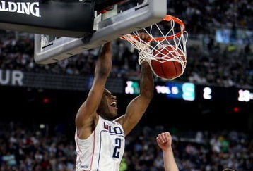 DETROIT - APRIL 04:  Stanley Robinson #21 of the Connecticut Huskies dunks against Goran Suton #14 of the Michigan State Spartans during the National Semifinal game of the NCAA Division I Men's Basketball Championship at Ford Field on April 4, 2009 in Detroit, Michigan.  (Photo by Gregory Shamus/Getty Images)