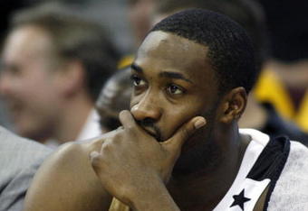 CLEVELAND - APRIL 21:  Gilbert Arenas #0 of the Washington Wizards looks on from the bench late in the game while playing the Cleveland Cavaliers in Game Two of the Eastern Conference Quarterfinals during the 2008 NBA Playoffs at Quicken Loans Arena April 21, 2008 in Cleveland, Ohio. Cleveland won the game 116-86. NOTE TO USER: User expressly acknowledges and agrees that, by downloading and or using this photograph, User is consenting to the terms and conditions of the Getty Images License Agreement.  (Photo by Gregory Shamus/Getty Images)