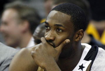 CLEVELAND - APRIL 21:  Gilbert Arenas #0 of the Washington Wizards looks on from the bench late in the game while playing the Cleveland Cavaliers in Game Two of the Eastern Conference Quarterfinals during the 2008 NBA Playoffs at Quicken Loans Arena April 21, 2008 in Cleveland, Ohio. Cleveland won the game 116-86. NOTE TO USER: User expressly acknowledges and agrees that, by downloading and or using this photograph, User is consenting to the terms and conditions of the Getty Images License Agreement.  (Photo by Gregory Shamus/Getty Images)