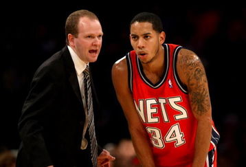 LOS ANGELES, CA - NOVEMBER 25:  Head coach Lawrence Frank and Devin Harris #34 of the New Jersey Nets confer during the game with the Los Angeles Lakers on November 25, 2008 at Staples Center in Los Angeles, California. The Lakers won 120-93.   NOTE TO USER: User expressly acknowledges and agrees that, by downloading and/or using this Photograph, user is consenting to the terms and conditions of the Getty Images License Agreement.  (Photo by Stephen Dunn/Getty Images)
