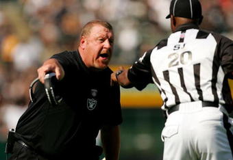 OAKLAND, CA - SEPTEMBER 27:  Oakland Raiders head coach Tom Cable argues with side judge Barry Anderson during their game against the Denver Broncos at the Oakland-Alameda County Coliseum on September 27, 2009 in Oakland, California.  (Photo by Ezra Shaw/Getty Images)