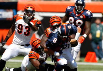 CINCINNATI, OH - SEPTEMBER 13: Quarterback Kyle Orton #8 of the Denver Broncos is sacked by Antwaan Odom #98 of the Cincinnati Bengals at Paul Brown Stadium on September 13, 2009 in Cincinnati, Ohio. (Photo by Scott Boehm/Getty Images)