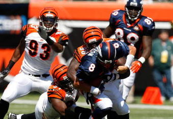 CINCINNATI, OH - SEPTEMBER 13: Quarterback Kyle Orton #8 of the Denver Broncos is sacked by Antwaan Odom #98 of the Cincinnati Bengals at Paul Brown Stadium on September 13, 2009 in Cincinnati, Ohio. (Photo by Scott Boehm/Getty Images)