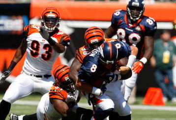 CINCINNATI, OH - SEPTEMBER 13: Quarterback Kyle Orton #8 of the Denver Broncos is sacked by Antwaan Odom #98 of the Cincinnati Bengals at Paul Brown Stadium on September 13, 2009 in Cincinnati, Ohio. (Photo by Scott Boehm/Getty Images)