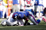 EAST RUTHERFORD, NJ - OCTOBER 11:  Justin Tuck #91 of the New York Giants sacks JaMarcus Russell #2 of the Oakland Raiders during the game on October 11, 2009 at Giants Stadium in East Rutherford, New Jersey.  (Photo by Jared Wickerham/Getty Images)