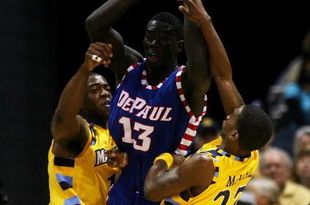 MILWAUKEE - JANUARY 24: Dwight Burke #12 (L) and Jerel McNeal #22 of the Marquette Golden Eagles trap Mac Koshwal #13 of the DePaul Blue Demons on March 24, 2009 at the Bradley Center in Milwaukee, Wisconsin. Marquette defeated DePaul 79-70. (Photo by Jonathan Daniel/Getty Images)