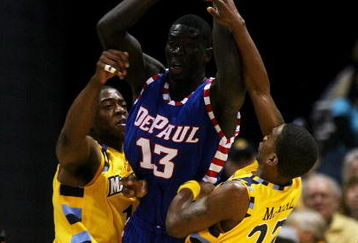 MILWAUKEE - JANUARY 24: Dwight Burke #12 (L) and Jerel McNeal #22 of the Marquette Golden Eagles trap Mac Koshwal #13 of the DePaul Blue Demons on March 24, 2009 at the Bradley Center in Milwaukee, Wisconsin. Marquette defeated DePaul 79-70. (Photo by Jonathan Daniel/Getty Images)