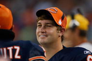 CHICAGO, IL - SEPTEMBER 3: Quarterback Jay Cutler #6 of the Chicago Bears talks with a team mate on the sidelines against the Cleveland Browns at Soldier Field on September 3, 2009 in Chicago, Illinois. (Photo by Scott Boehm/Getty Images)