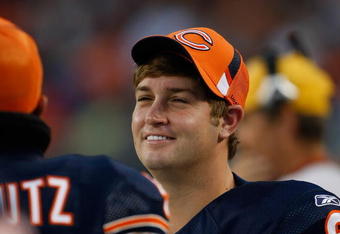 CHICAGO, IL - SEPTEMBER 3: Quarterback Jay Cutler #6 of the Chicago Bears talks with a team mate on the sidelines against the Cleveland Browns at Soldier Field on September 3, 2009 in Chicago, Illinois. (Photo by Scott Boehm/Getty Images)