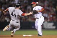ANAHEIM, CA - OCTOBER 08:   Howie Kendrick #47 of the Los Angeles Angels of Anaheim turns a double play on Jason Bay #44 at of the Boston Red Sox at second the throws to first base to get Mike Lowell #25 in  in Game One of the ALDS during the 2009 MLB Playoffs at Angel Stadium on October 8, 2009 in Anaheim, California.  (Photo by Kevork Djansezian/Getty Images)