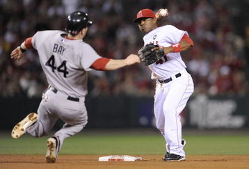 ANAHEIM, CA - OCTOBER 08:   Howie Kendrick #47 of the Los Angeles Angels of Anaheim turns a double play on Jason Bay #44 at of the Boston Red Sox at second the throws to first base to get Mike Lowell #25 in  in Game One of the ALDS during the 2009 MLB Playoffs at Angel Stadium on October 8, 2009 in Anaheim, California.  (Photo by Kevork Djansezian/Getty Images)