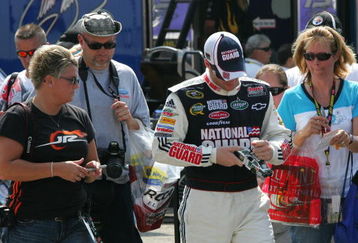 BROOKLYN, MI - AUGUST 14:  Dale Earnhardt Jr.,  driver of the #88 National Guard/AMP Energy Chevrolet signs aoutographs for fans, during practice for the NASCAR Sprint Cup Series Michigan 400 at Michigan Internetional Speedway on August 14, 2009 in Brooklyn, Michigan.  (Photo by Jerry Markland/Getty Images for NASCAR)