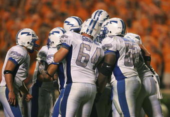 KNOXVILLE, TN - SEPTEMBER 9:    The Air Force Academy Falcons offense huddles just before scoring their final touchdown against the University of Tennessee Volunteers on September 9, 2006 at Neyland Stadium in Knoxville, Tennessee. Tennessee won 31-30.  (Photo by Stephen Dunn/Getty Images)