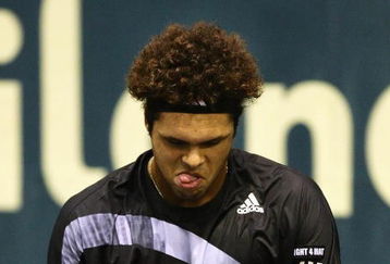 BANGKOK, THAILAND - OCTOBER 02:  Jo-Wilfried Tsonga of France shows his frustration with his racquet during his match against Marco Chiudinelli of Switzerland during day seven of the 2009 Thailand Open at Impact Arena on October 2, 2009 in Bangkok, Thailand.  (Photo by Mark Dadswell/Getty Images)