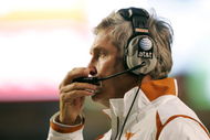 AUSTIN, TX - OCTOBER 10:  Head coach Mack Brown of the Texas Longhorns calls in a play against the Colorado Buffaloes on October 10, 2009 at Darrell K Royal-Texas Memorial Stadium in Austin, Texas.  Texas won 38-14.  (Photo by Brian Bahr/Getty Images)