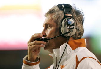 AUSTIN, TX - OCTOBER 10:  Head coach Mack Brown of the Texas Longhorns calls in a play against the Colorado Buffaloes on October 10, 2009 at Darrell K Royal-Texas Memorial Stadium in Austin, Texas.  Texas won 38-14.  (Photo by Brian Bahr/Getty Images)