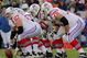 DENVER - OCTOBER 11:  Center Dan Koppen #67 of the New England Patriots prepares to snap the ball as the offensive line readies for pass protection against the Denver Broncos during NFL action at Invesco Field at Mile High on October 11, 2009 in Denver, Colorado. The Broncos defeated the Patriots 20-17 in overtime.  (Photo by Doug Pensinger/Getty Images)