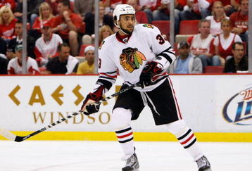 DETROIT - MAY 27:  Dustin Byfuglien #33 of the Chicago Blackhawks skates against the Detroit Red Wings during Game Five of the Western Conference Championship Round of the 2009 Stanley Cup Playoffs on May 27, 2009 at Joe Louis Arena in Detroit, Michigan. The Red Wings won 2-1 in overtime.  (Photo by Gregory Shamus/Getty Images)
