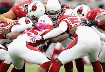 GLENDALE, AZ - OCTOBER 11:  Arizona Cardinal's huddle up before the NFL game against the Houston Texans at the Universtity of Phoenix Stadium on October 11, 2009 in Glendale, Arizona. The Cardinals defeated the Texans 28-21.  (Photo by Christian Petersen/Getty Images)